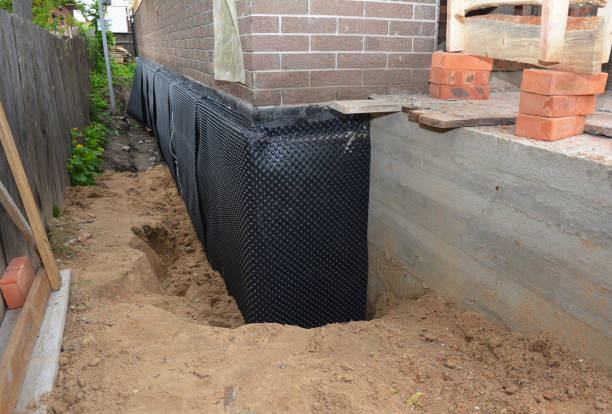 Happy homeowners after waterproofing job in New Richmond